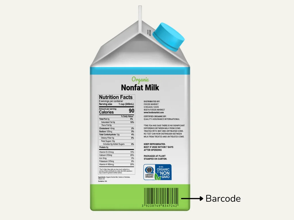A barcode pointed out on the side of a milk carton.