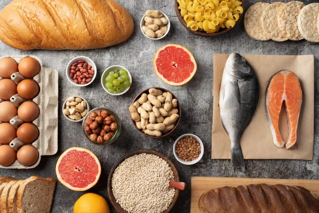 top view of common food allergens including: nuts, fish, eggs, gluten.