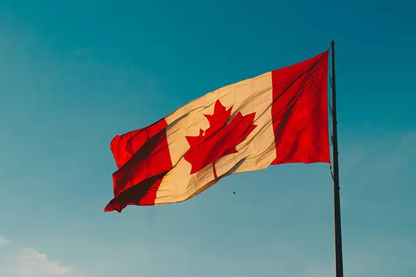 Canadian flag with clear, blue sky in the background