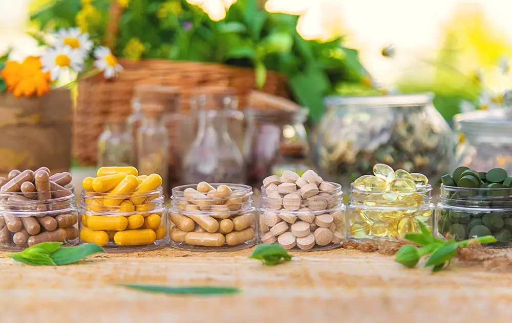 A range of dietary supplements in clear containers.