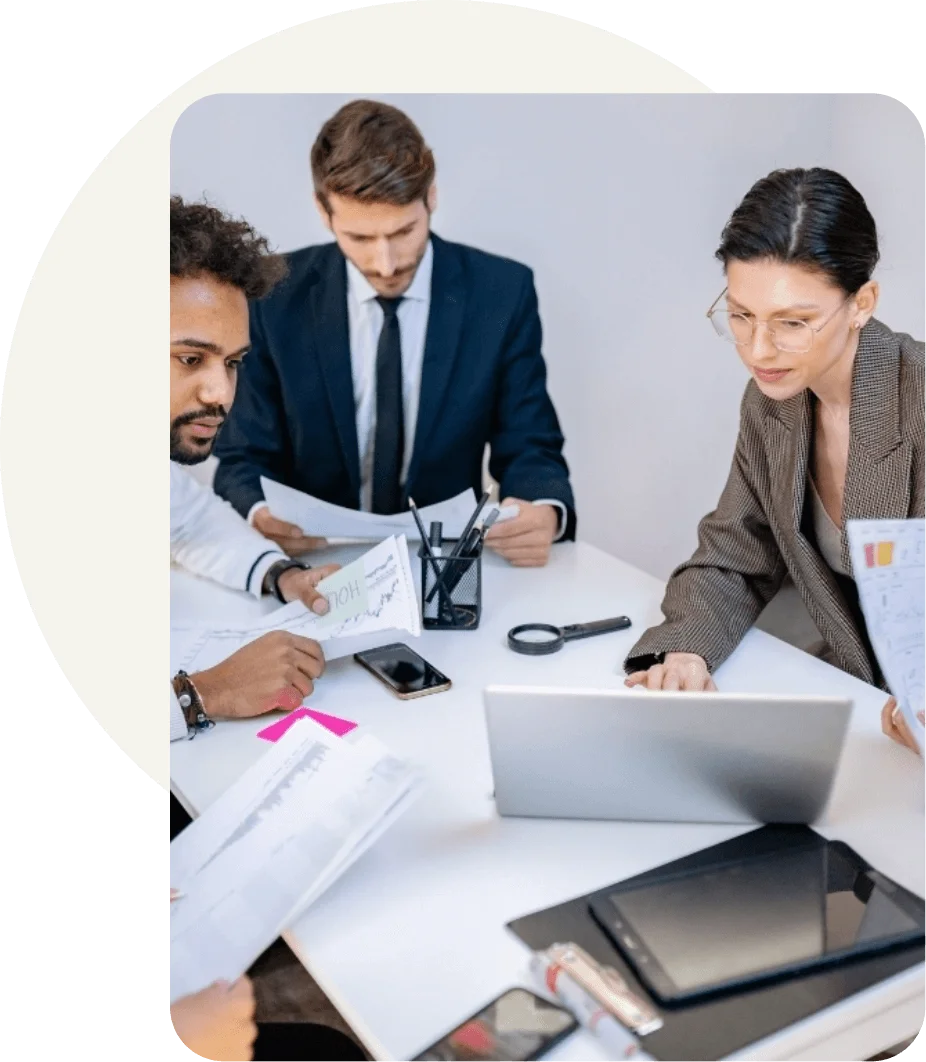 Food and supplement regulatory team reviewing compliance documents and nutrition labeling data during a collaborative office meeting