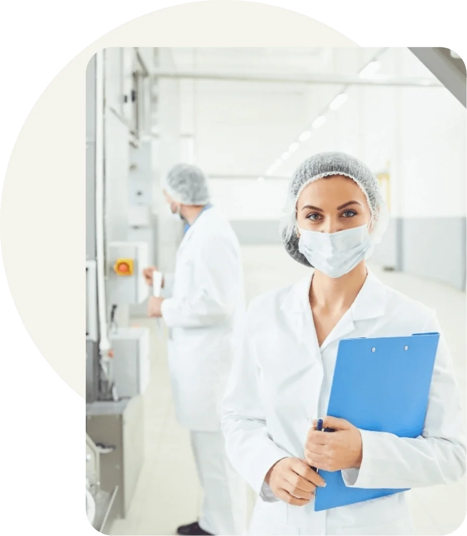 Quality assurance specialist conducting a compliance inspection on a food manufacturing production floor